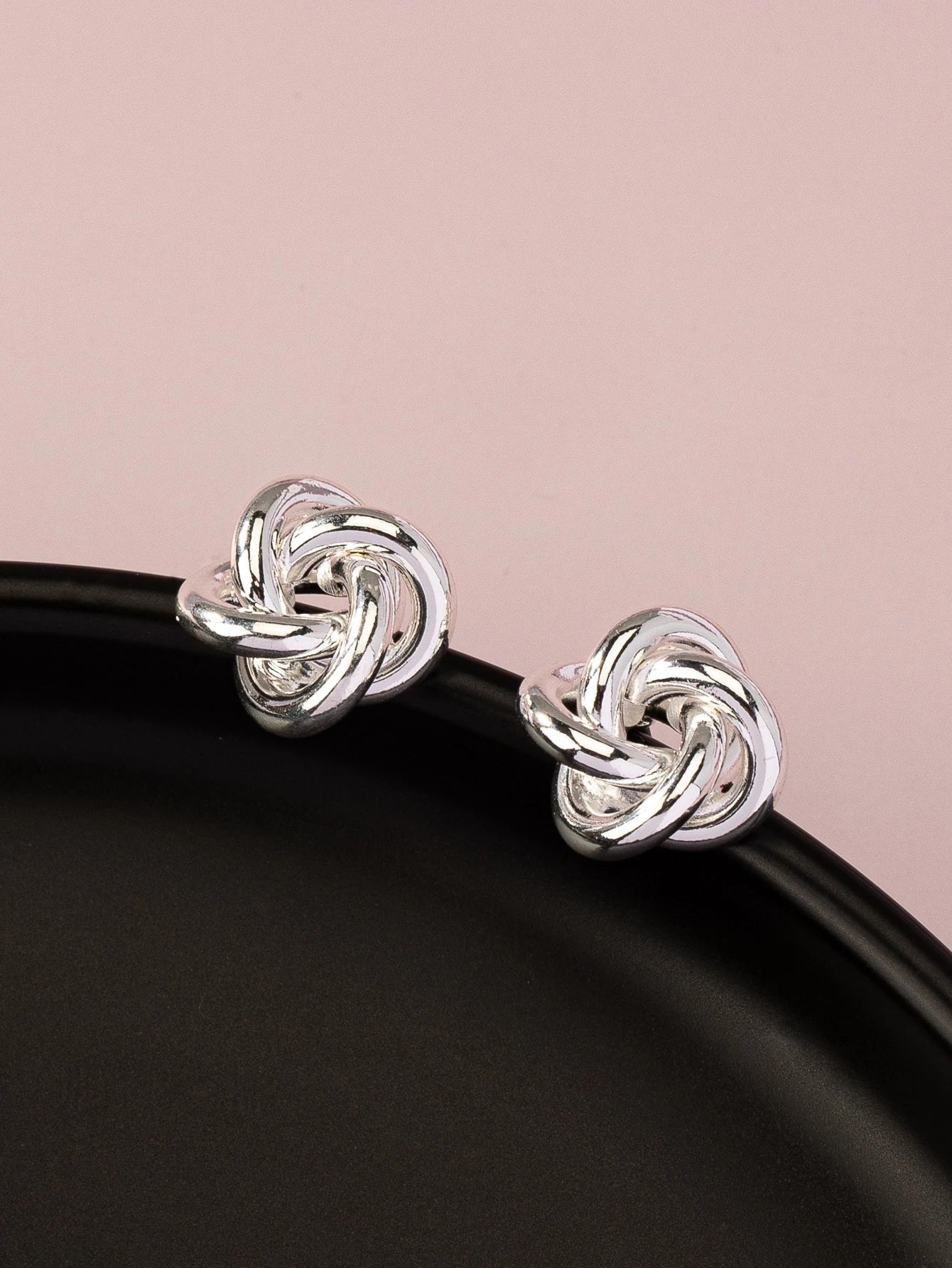 SILVER TONED TWIST STUD EARRINGS