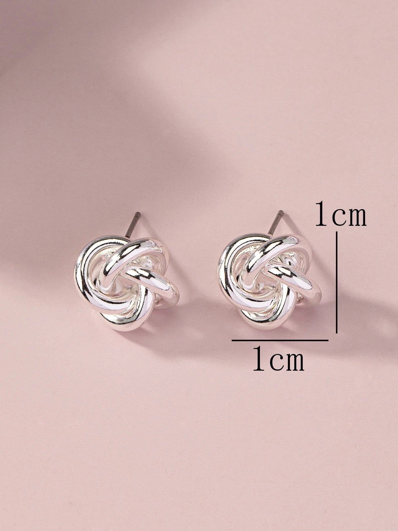 SILVER TONED TWIST STUD EARRINGS
