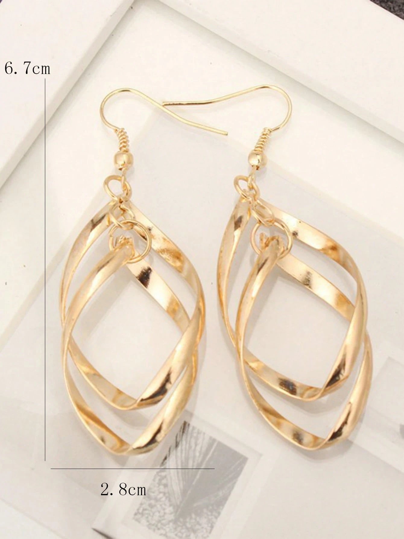GOLD TONED SPIRAL CURVED WAVE EARRINGS