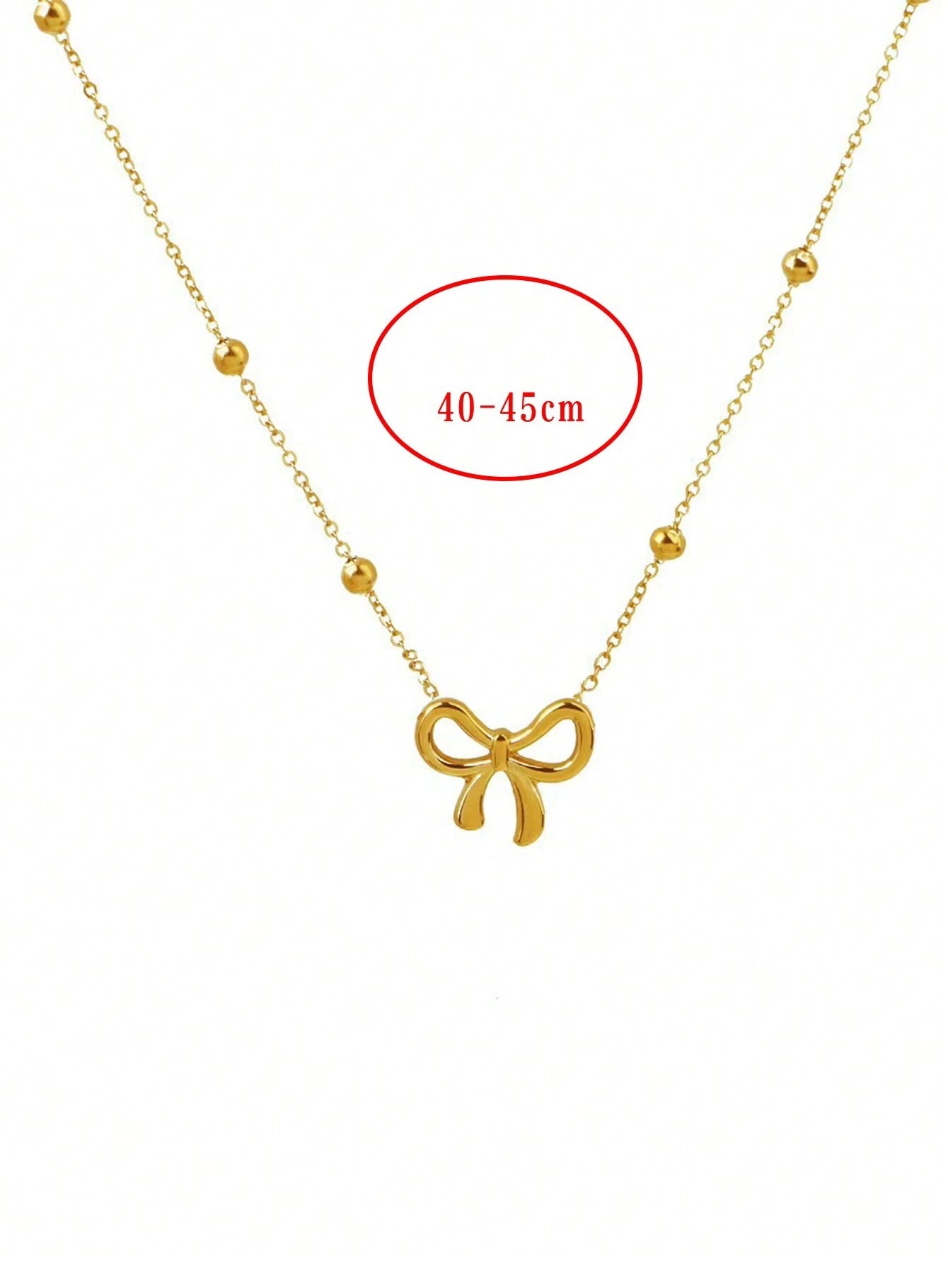 GOLD TONED BOW NECKLACE