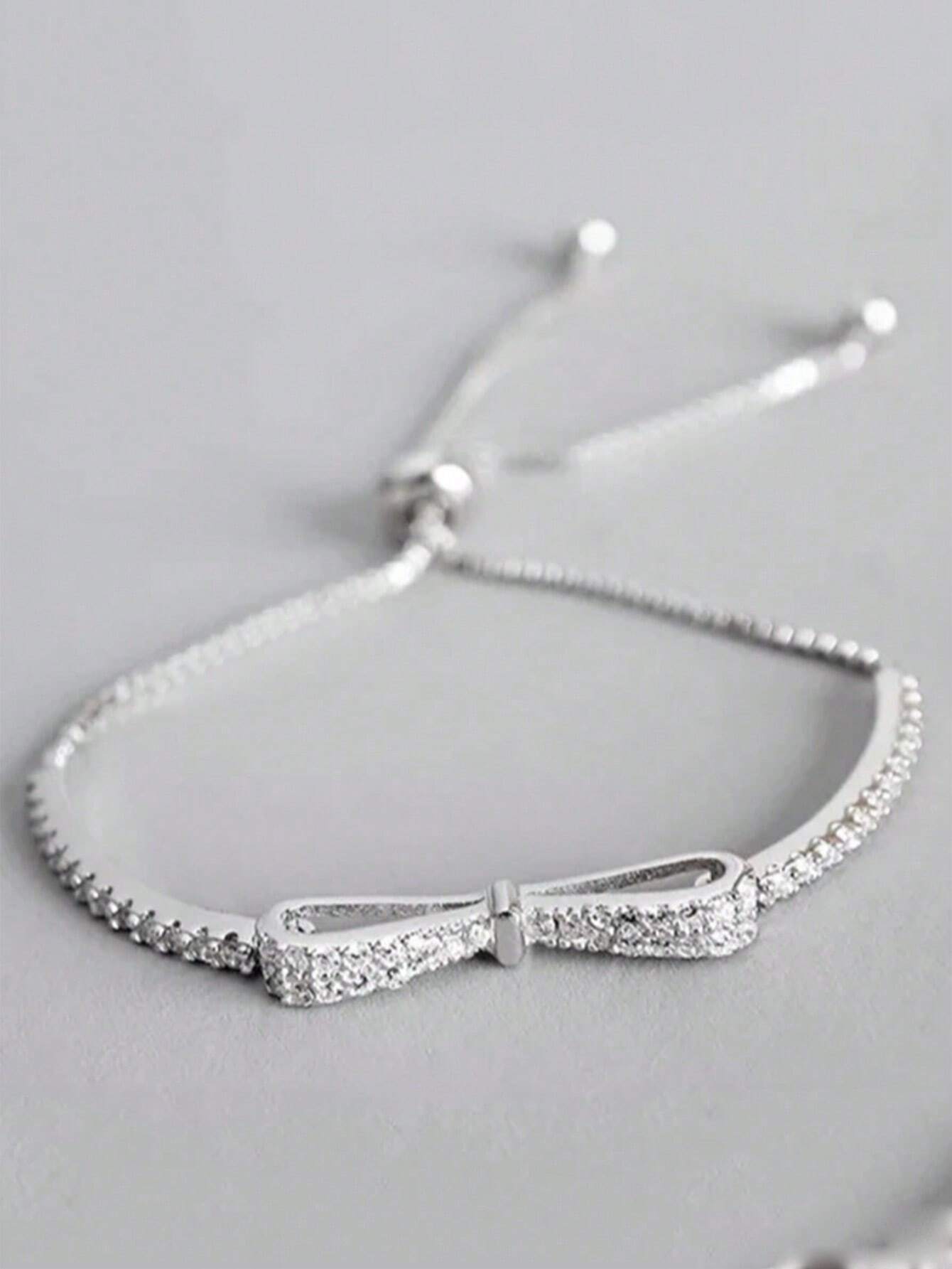 SILVER TONED BOW BRACELET
