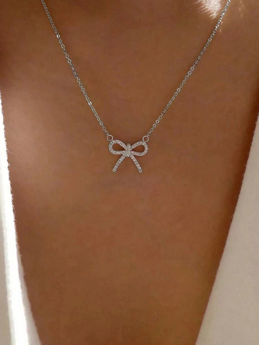 SILVER TONED BOW NECKLACE